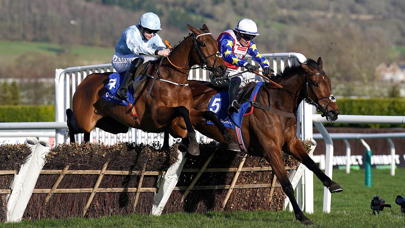 Honeysuckle ridden by jockey Rachael Blackmore (left) clear a fence on their way to winning the Close Brothers Mares' Hurdle on day one of the Cheltenham Festival at Cheltenham Racecourse. Picture date: Tuesday March 14, 2023.