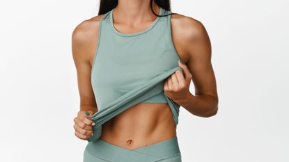 a photo of a woman with strong abs