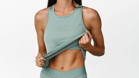 a photo of a woman with strong abs