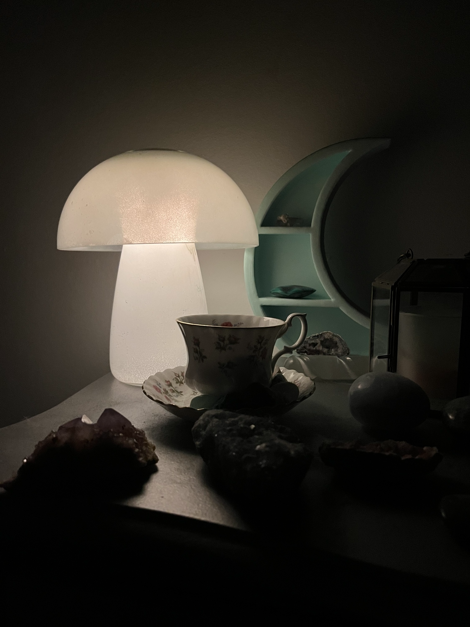 A mushroom lamp lit up on a table