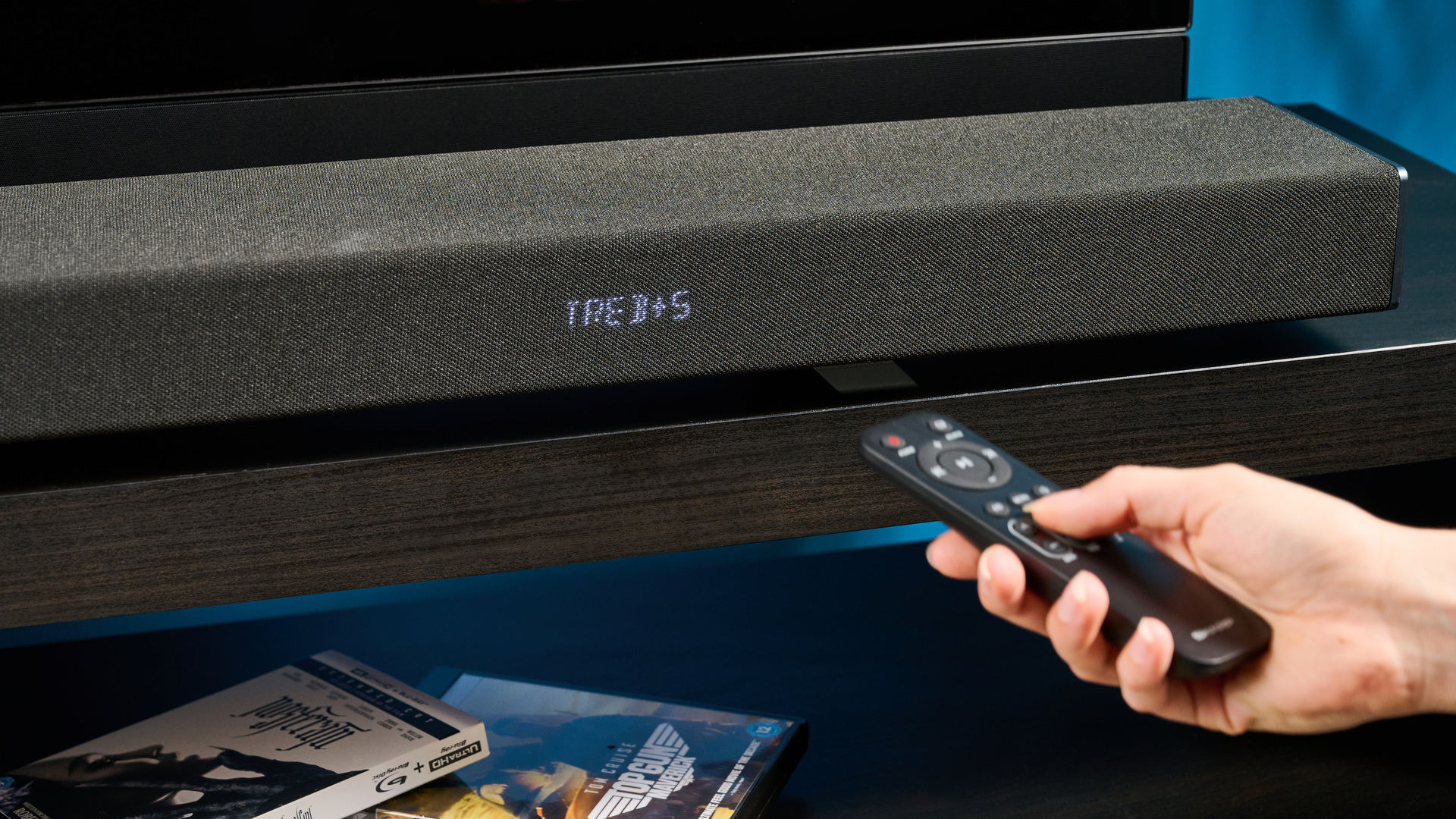 The Sharp 5.1.2 HT-SBW55121 Soundbar photographed in front of a blue background.