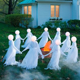 ghosts holding hands on front lawn
