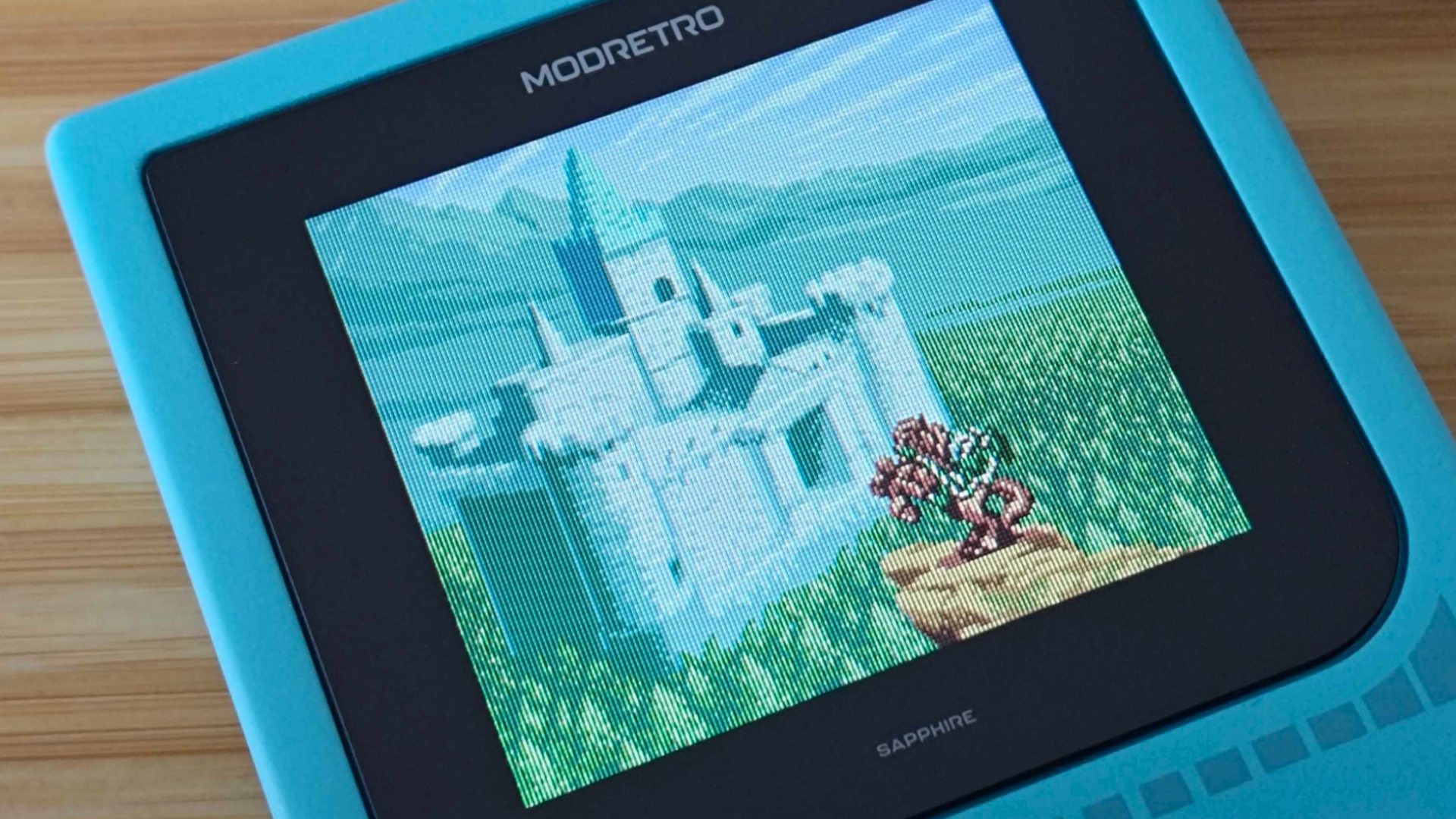 Modretro Chromatic with closeup of Zelda: Oracle of Seasons intro with Link on horse in front of castle