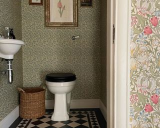 Small bathroom with green wallpaper