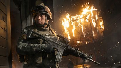 A solider standing in front of a burning building in Modern Warfare 4