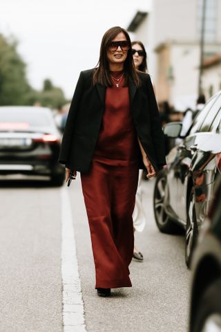 woman wearing red satin dress and black blazer