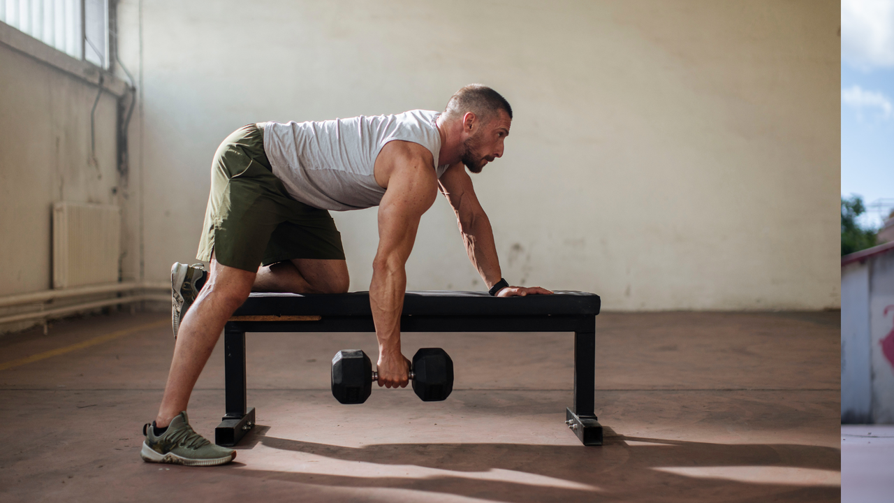 Man doing single arm dumbbell rows