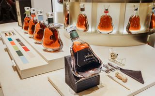 Bottles of Hennessy Paradis cognac with differently coloured neck labels that can be personalised
