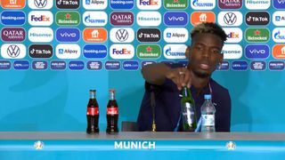 France midfielder Paul Pogba moves a Heineken bottle during a Euro 2020 press conference