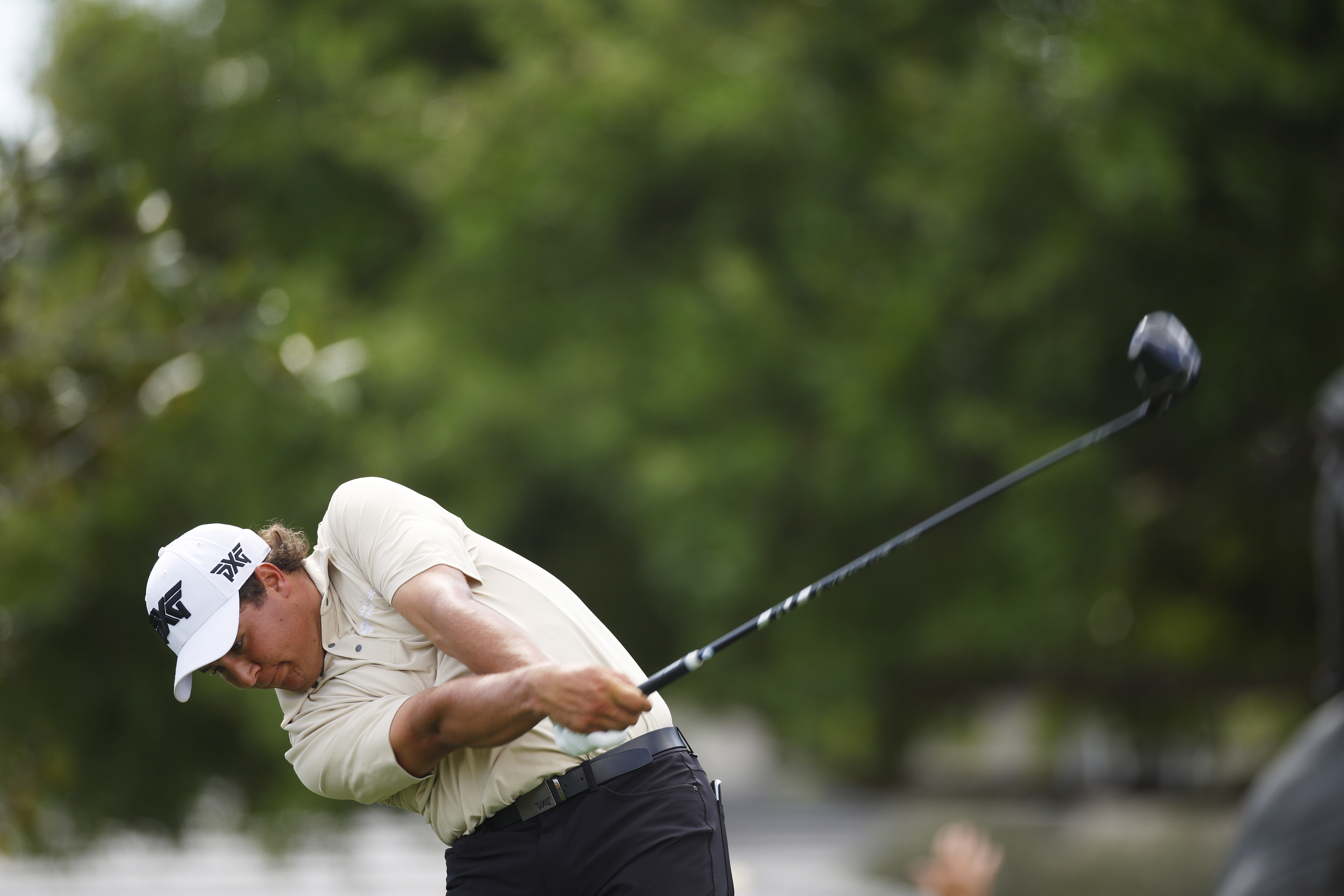 Aldrich Potgieter with driver hitting a long drive