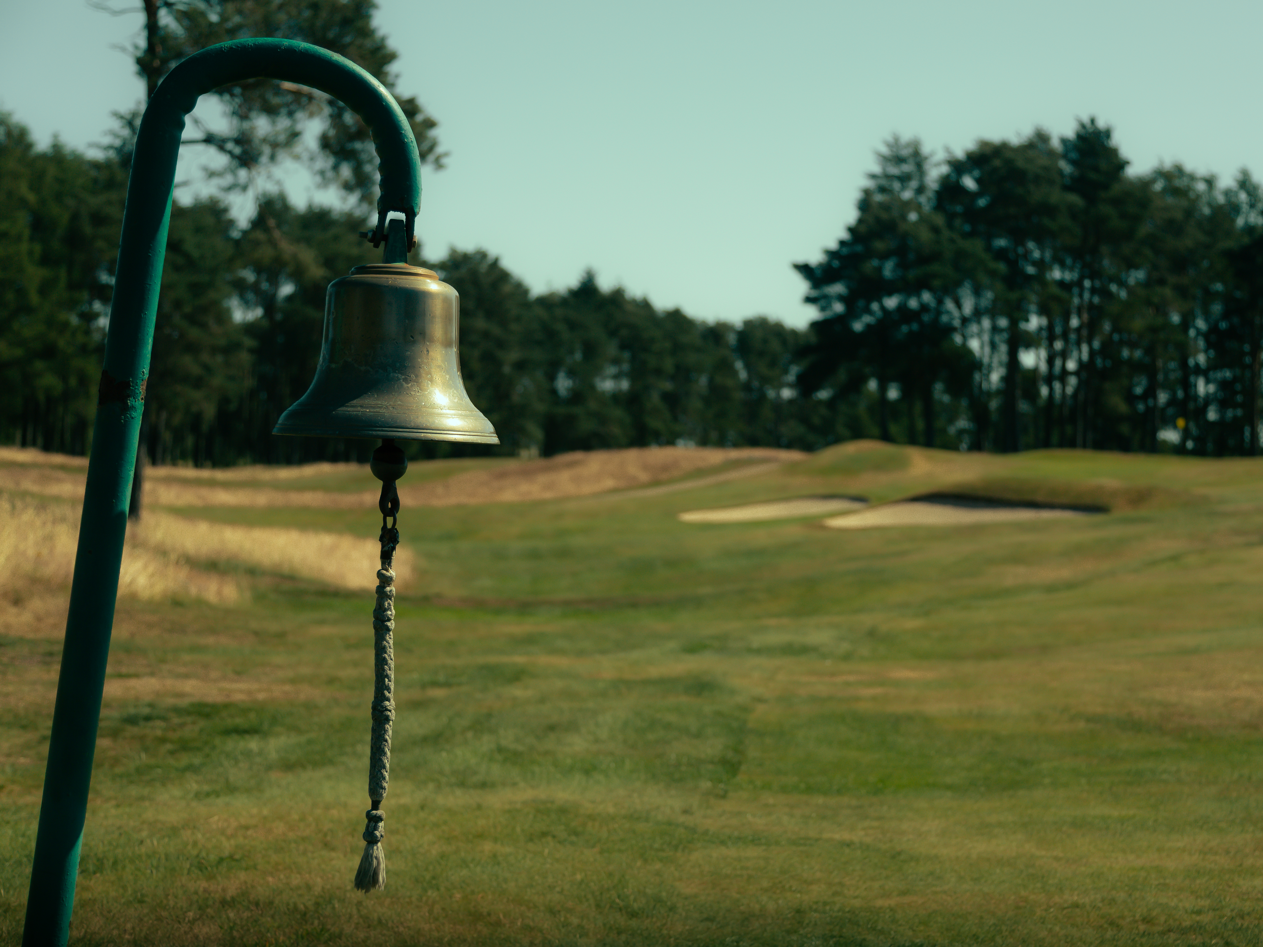 A bell seen on a golf hole