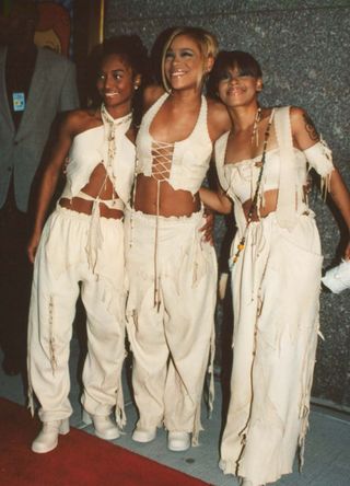 Members of R&B group TLC (L-R): Chilli (Rozonda Thomas), T-Boz (Tionne Watkins), Left Eye (Lisa Lopes) at the MTV Music Awards. (Photo by Arlene Richie/Getty Images)