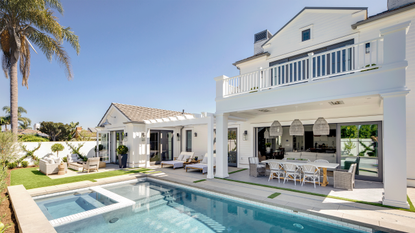 Pergola and outdoor seating area beside an outdoor pool