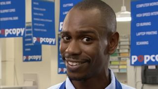 Dave Chappelle smiling into the camera for PopCopy sketch on Chappelle's Show