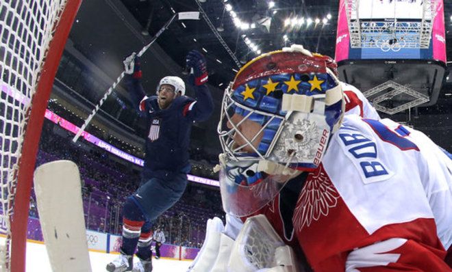 Phil Kessel of the United States celebrates after teammate Cam Fowler scored a goal on Sergei Bobrovski of Russia in Sochi.