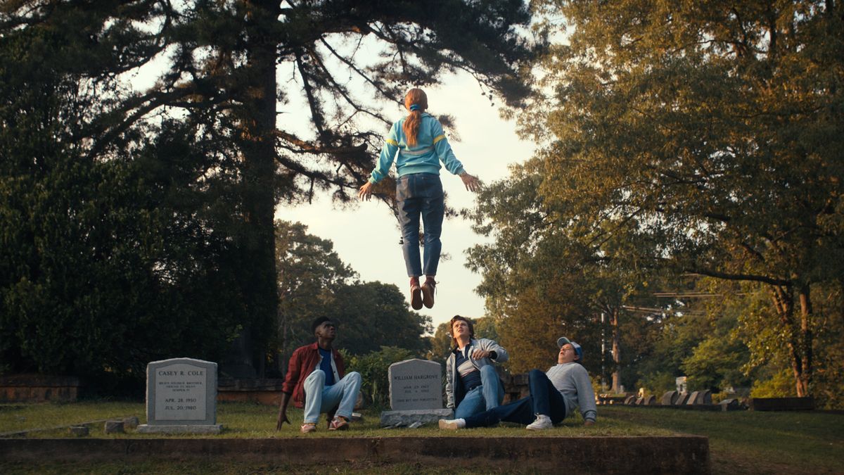 Sadie Sink as Max levitating above a grave in Stranger Things