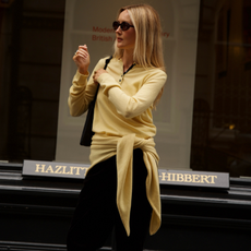 An image of a woman showcasing how to style fall basics 2026