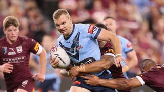 om Trbojevic of the Blues is tackled during game one of the 2021 State of Origin