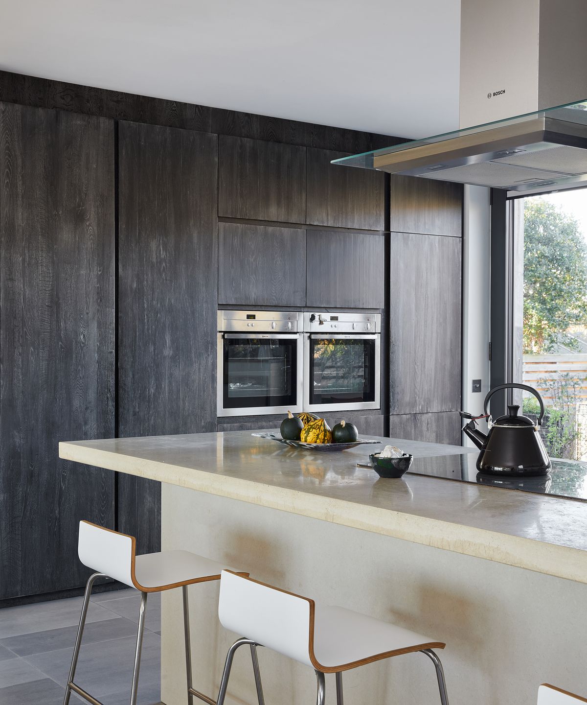 Built in dark oak cabinetry with double oven