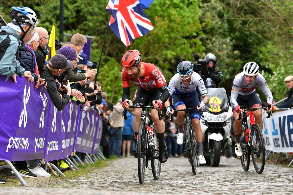 OVERIJSE BELGIUM APRIL 13 LR Victor Campenaerts of Belgium and Team Lotto Soudal Giacomo Nizzolo of Italy and Team Israel Premier Tech and Alexander Kamp Egested of Denmark and Team Trek Segafredo competes at Moskesstraat cobblestones sector during the 62nd De Brabantse Pijl La Flche Brabanonne 2022 Mens Elite a 2051km one day race from Leuven to Overijse BP22 on April 13 2022 in Overijse Belgium Photo by Luc ClaessenGetty Images