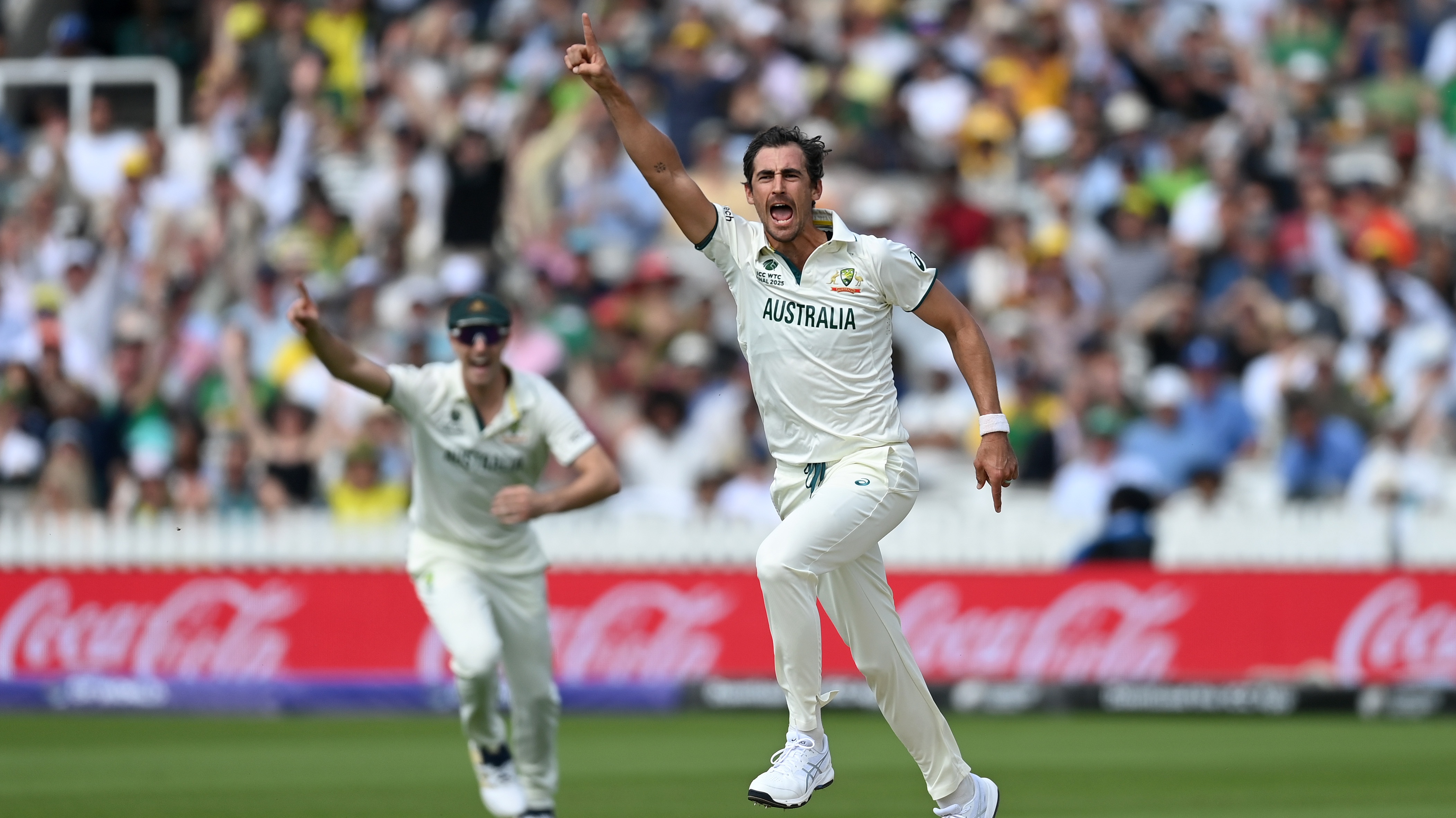 Mitchell Starc of Australia celebrates dismissing Aiden Markram of South Africa during day one of the ICC World Test Championship Final between South Africa and Australia