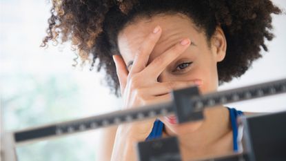 Woman making the connection between stress and weight gain