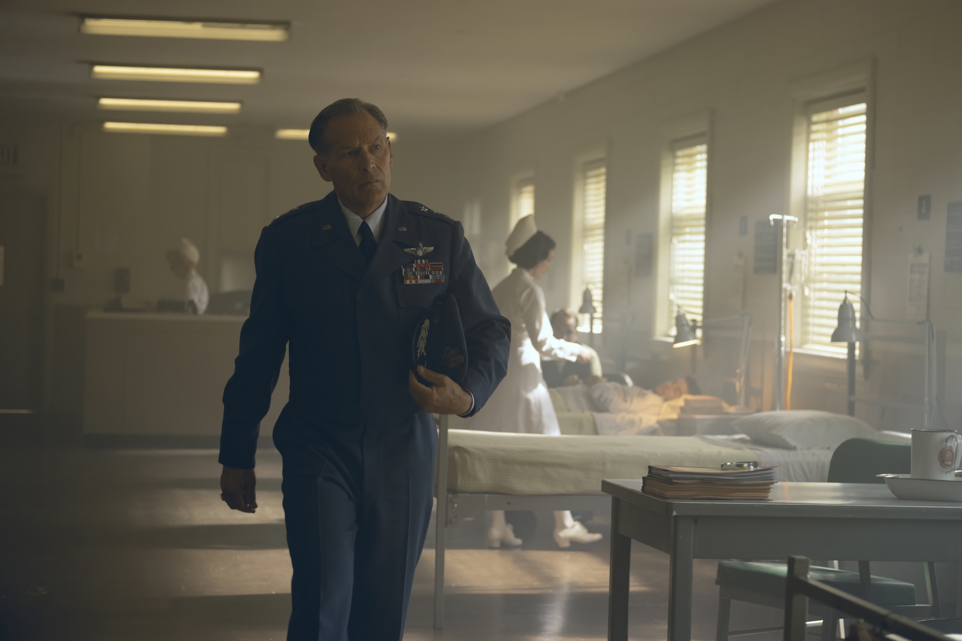 A military general (James Remar as General Shaw) walks through a 1960s-era hospital wing, in &#039;It: Welcome to Derry.&#039;