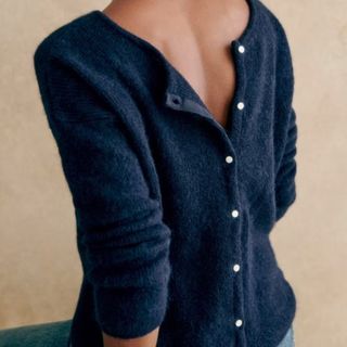 Image of navy cardigan being worn