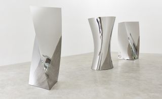 Installation view of ’Gathering Clouds’ at Kukje Gallery. Three large silver objects with different shapes.