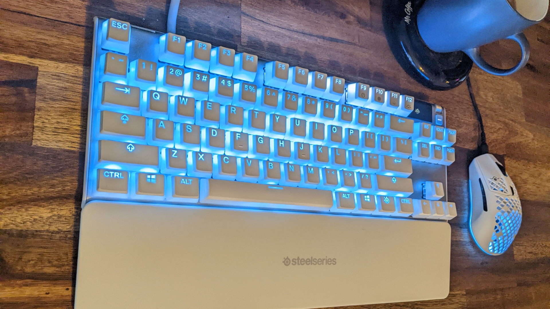 Lauren's matching keyboard and mouse, glowing a subtle blue