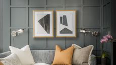 A living room with grey walls and pillows in yellow