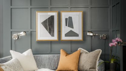 A living room with grey walls and pillows in yellow