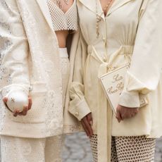 Two fashion week attendees wearing neutral nail looks