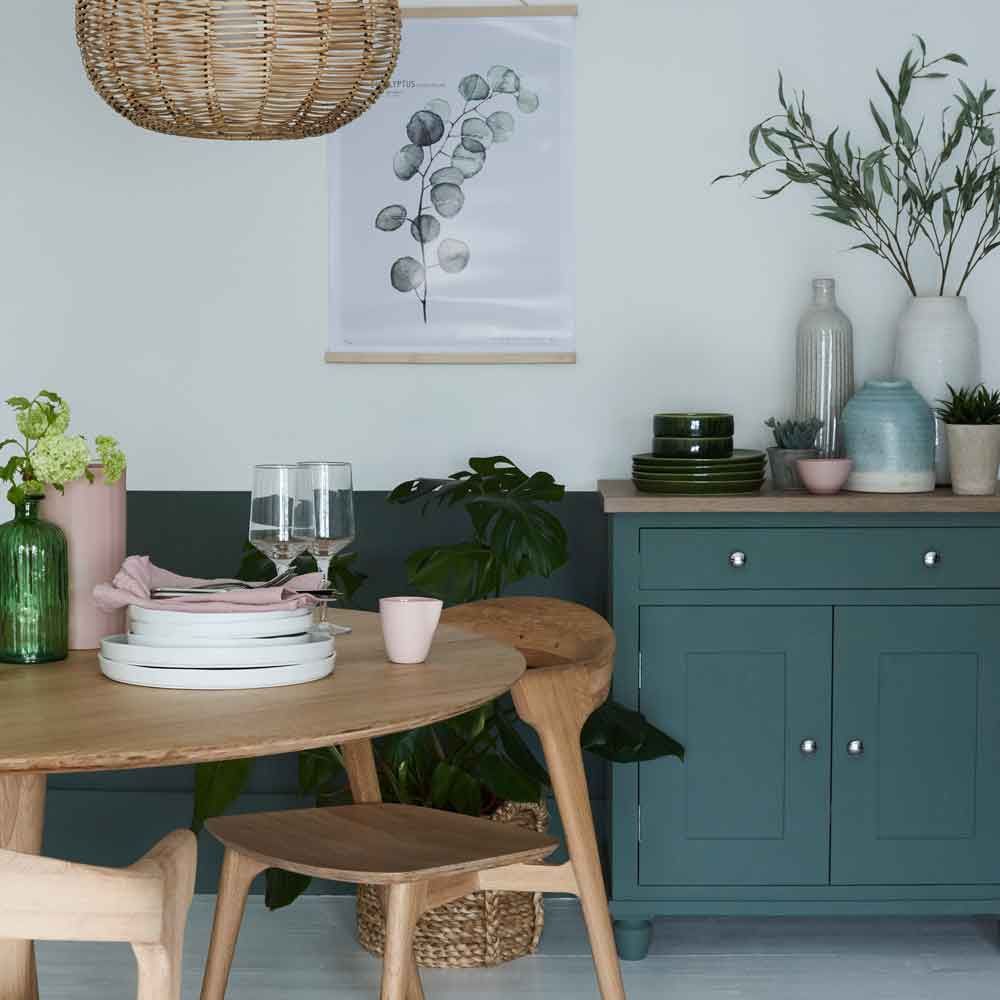 dining area with wooden table and chairs with cabinet