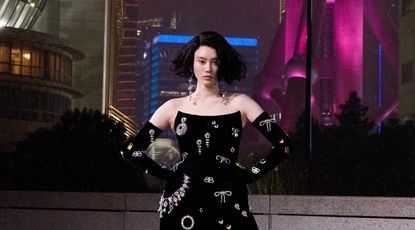 Best of Cruise 2025: woman walks Balenciaga runway in jewellery covered dress in Shanghai