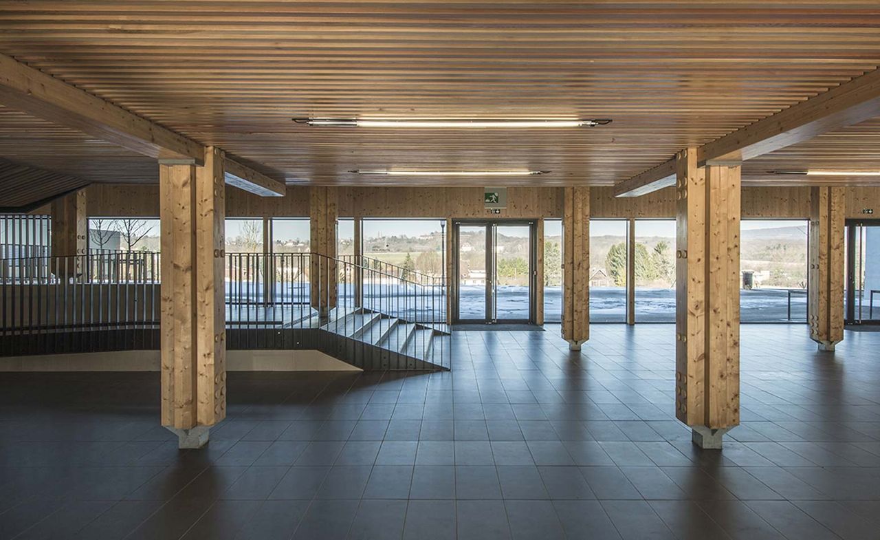 Ground floor of a school with a wood-lined interior