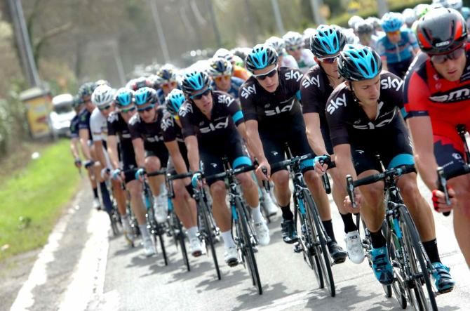 Team Sky tag onto the back of the BMC-lead peloton
