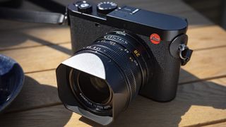 Leica Q3 camera on a wooden table