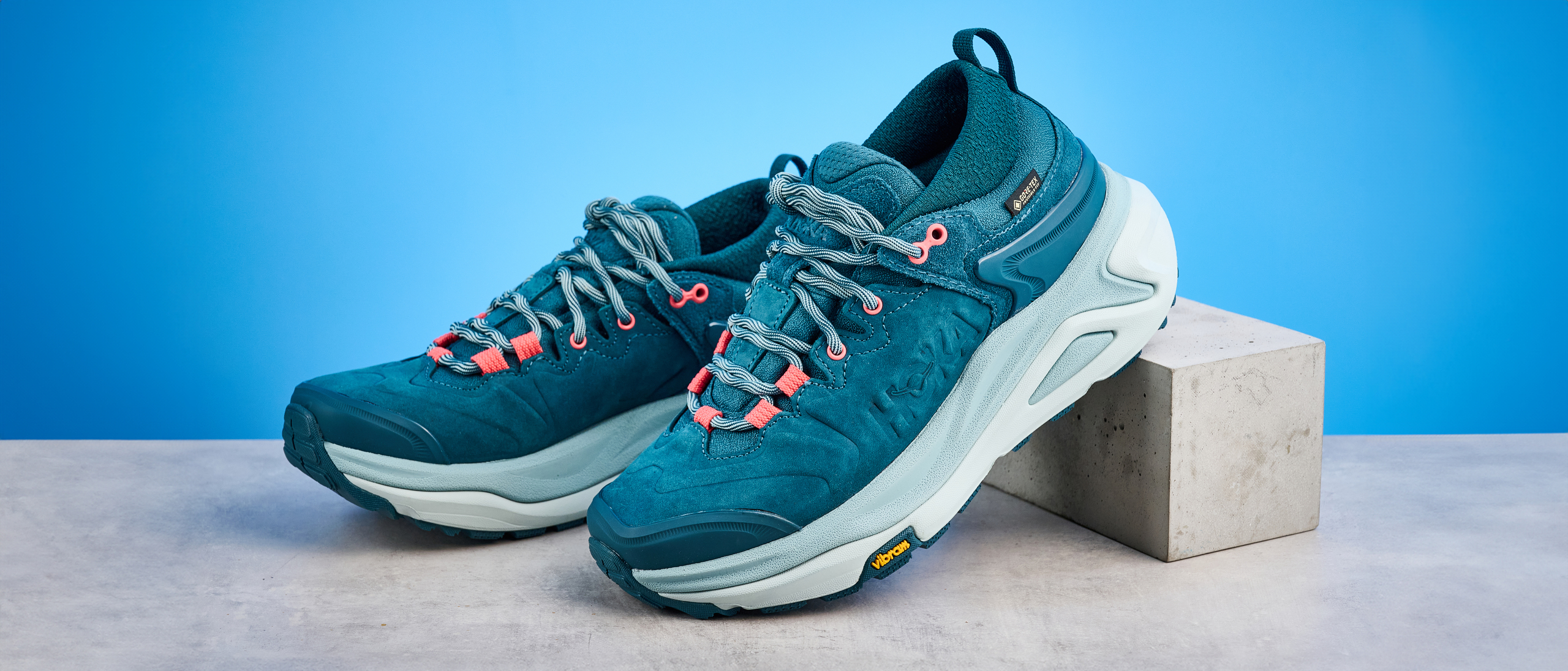 Hoka Kaha 3 Low GTX in droplet colorway photographed in front of a blue background
