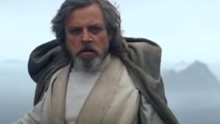 Mark Hamill with a beard, taking off a cloak in The Rise of Skywalker