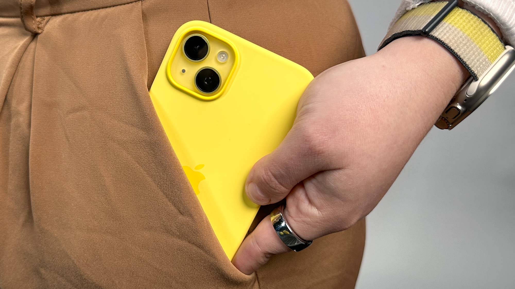Yellow iPhone 14 Plus in pocket
