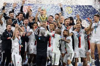 Besiktas players celebrate after winning the Turkish Super Cup in Doha in January 2022.
