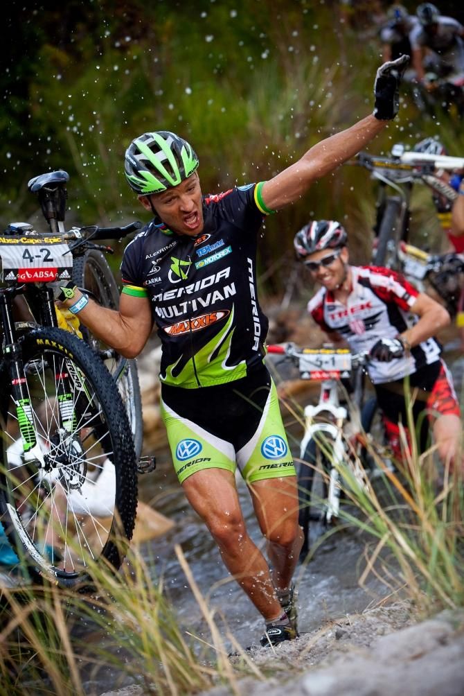Ralph N&auml;f makes his way through a deep river crossing during stage 3 of the 2011 Cape Epic, just in front of Lukas Fl&uuml;ckiger