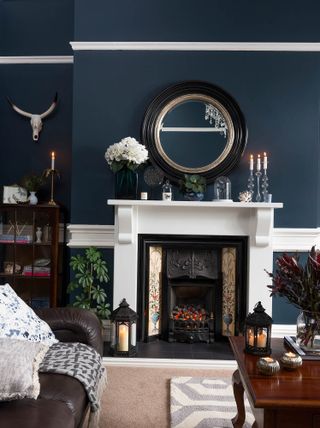 traditional living room with dark grey walls and a wooden coffee table