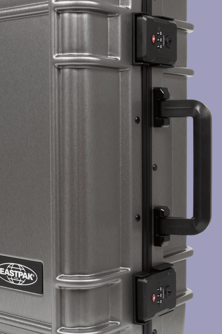 Eastpak Resist'r Case S shown up close and in full in a rotating gif against purple background.