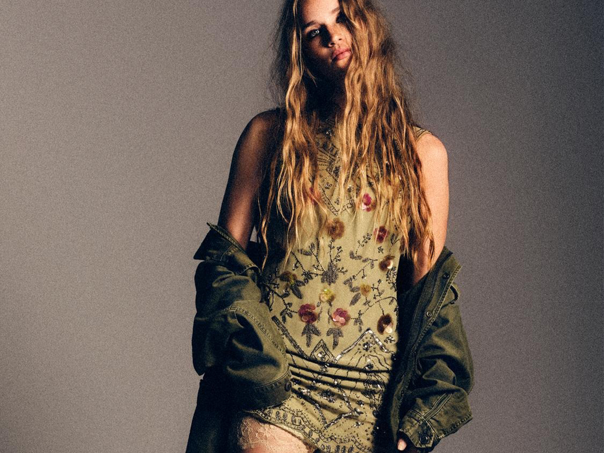 Zara model wearing a sequin dress.