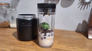 KitchenAid Go Cordless blender with smoothie ingredients in it