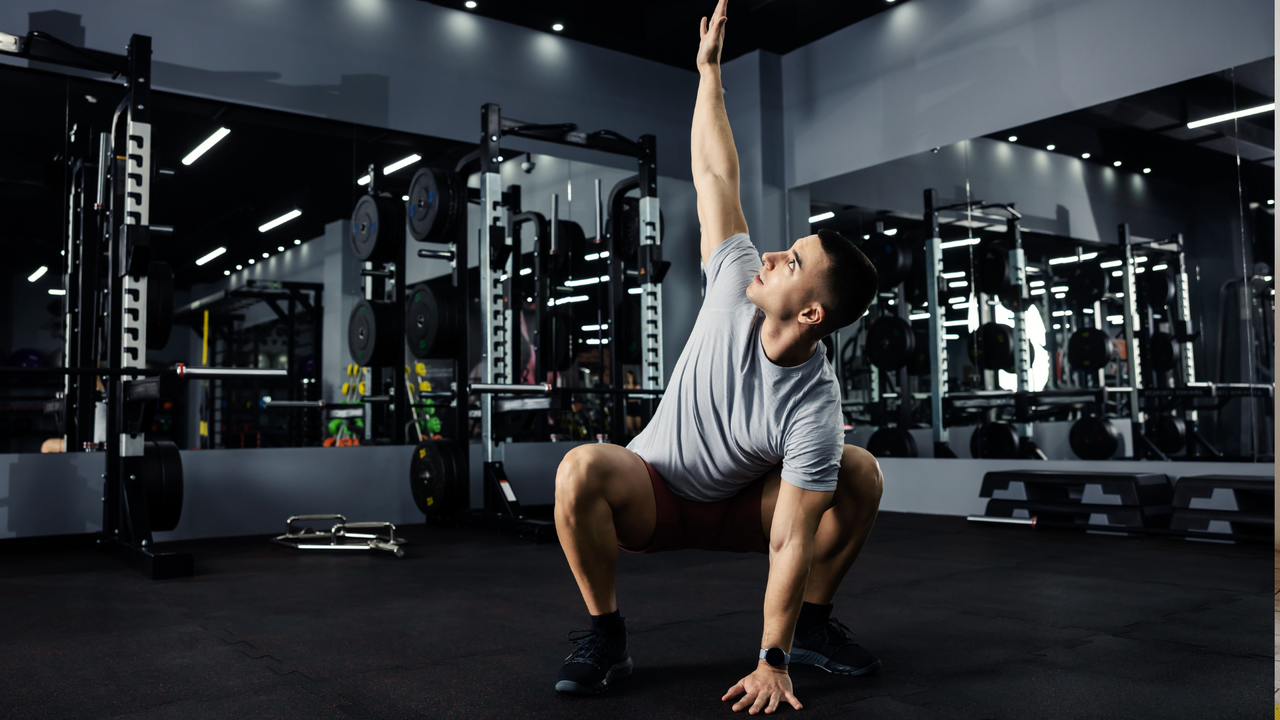 Man doing squat with rotation