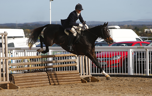 Brumous and Melanie Duff jumping at Aintree
