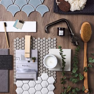 bathroom tile designs and accessories on wooden table